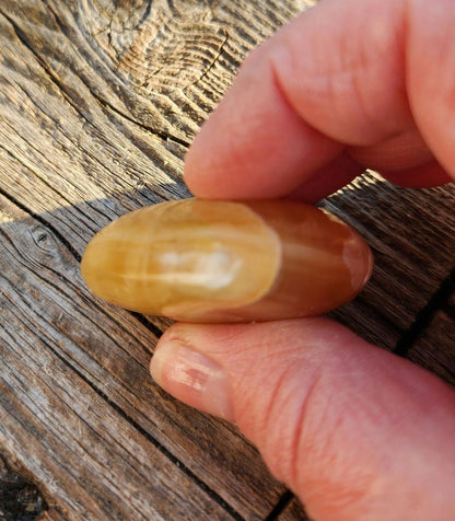 AAA Honey Calcite Crystal Heart: Golden Hues, Polished Stone