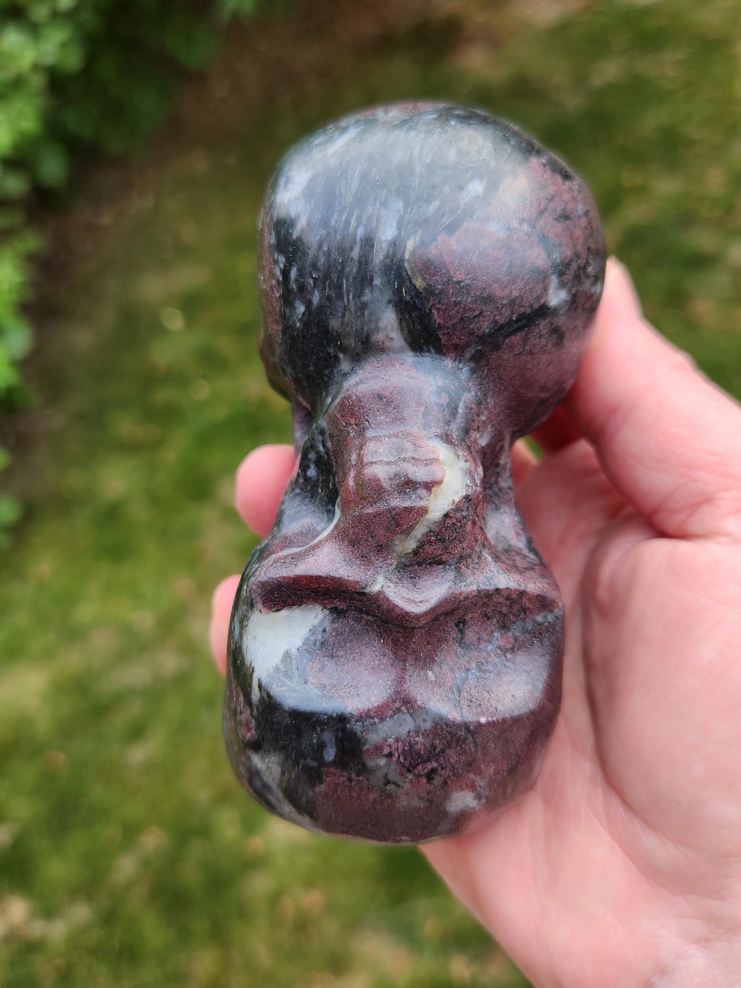 Double Skull in Garnet with Fireworks or Arfvedsonite Crystal Carving