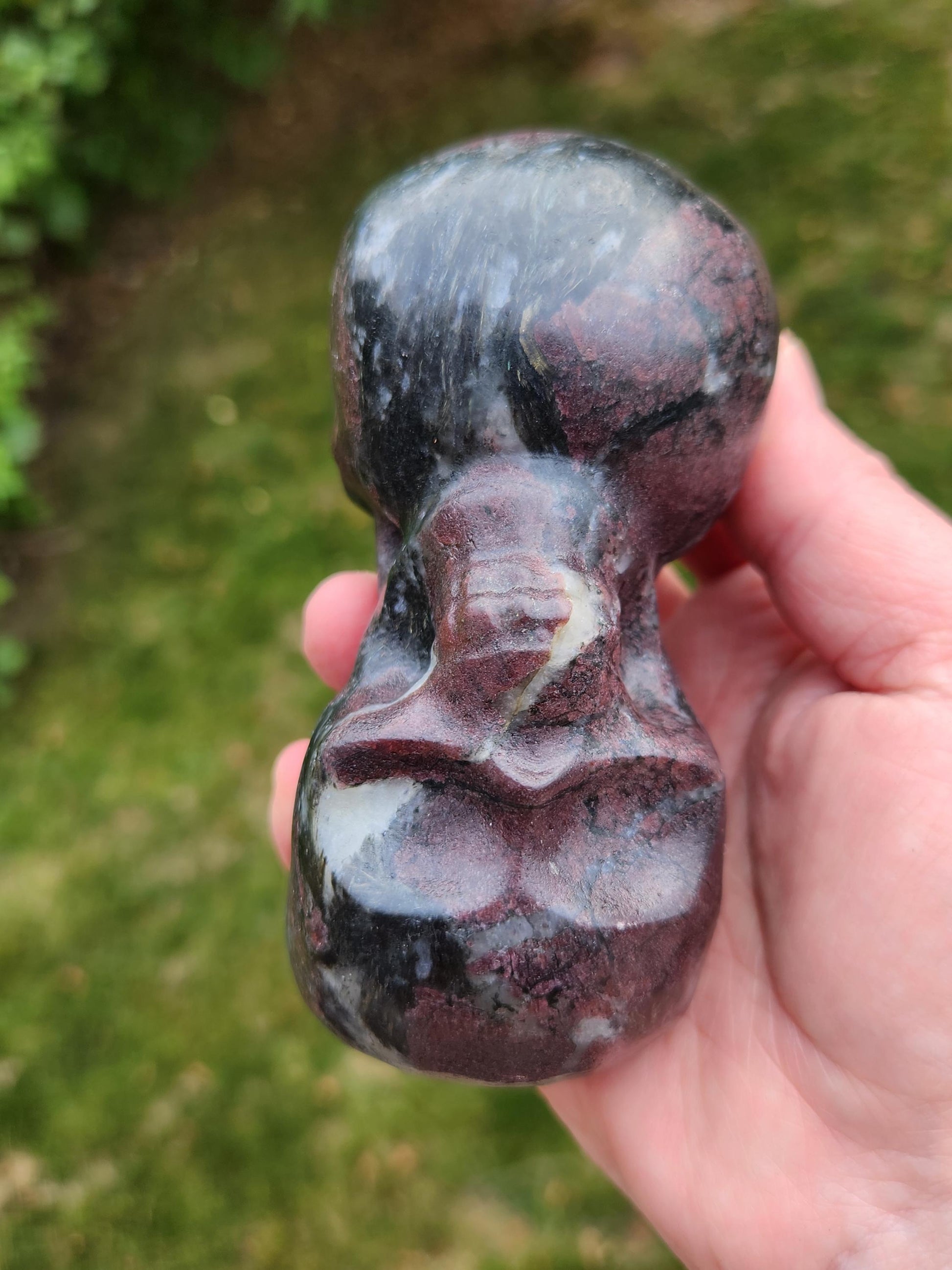 Double Skull in Garnet with Fireworks or Arfvedsonite Crystal Carving