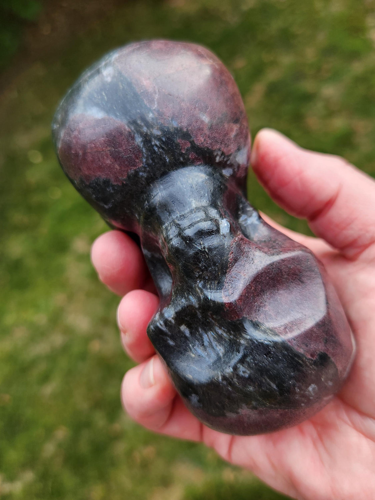 Double Skull in Garnet with Fireworks or Arfvedsonite Crystal Carving