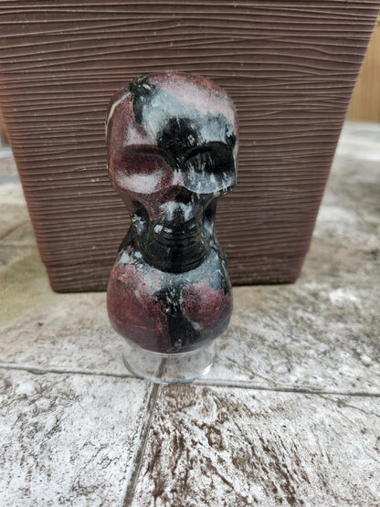 Double Skull in Garnet with Fireworks or Arfvedsonite Crystal Carving
