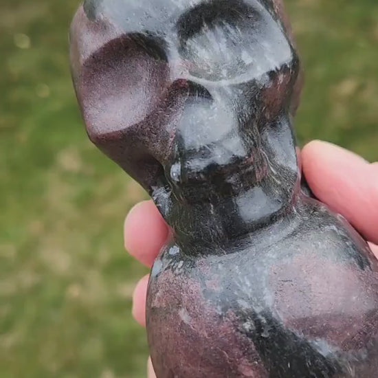 Double Skull in Garnet with Fireworks or Arfvedsonite Crystal Carving